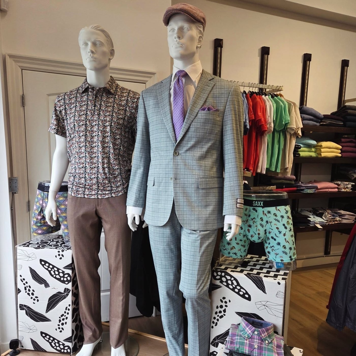 Light grey windowpane suit styled on a mannequin in store at Buragina's